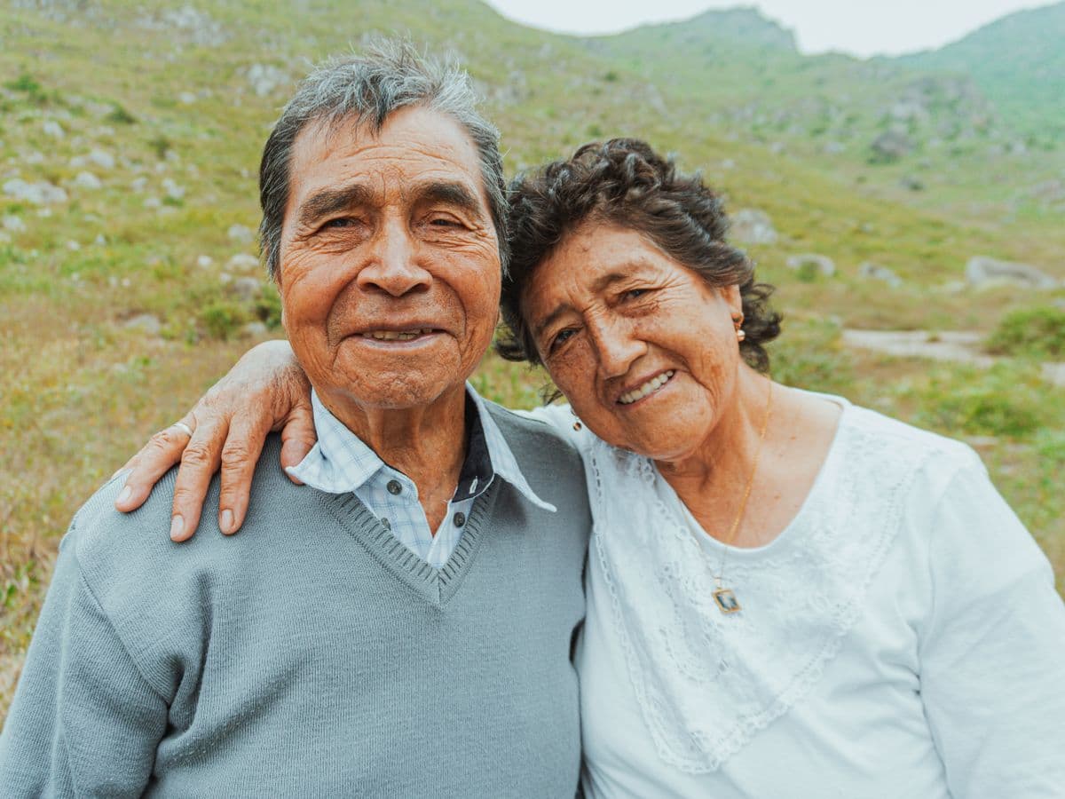 A couple relieved after resolving their mortgage delinquency and keeping their home